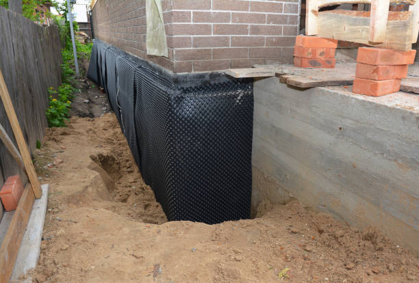 SJ Waterproofing Pros technician performing targeted Interior Drainage System assessment in Mukwonago, WI